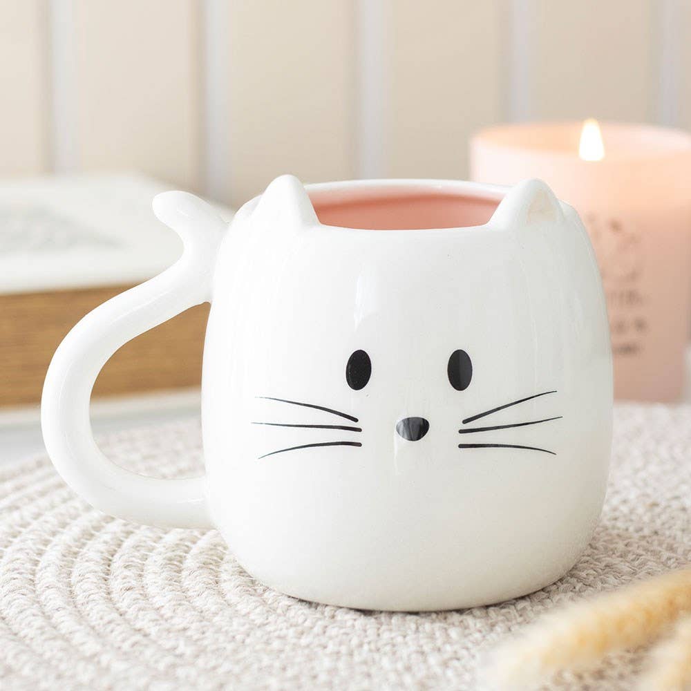 Weiße katzenförmige Tasse